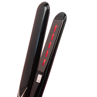 Black infrared hair straightener with red accents on a white background