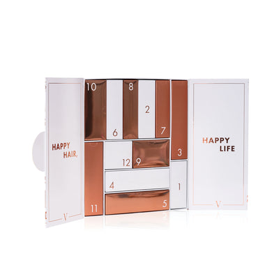 Advent calendar with rose gold and white design, featuring numbers and text showing the 12 days of christmas.