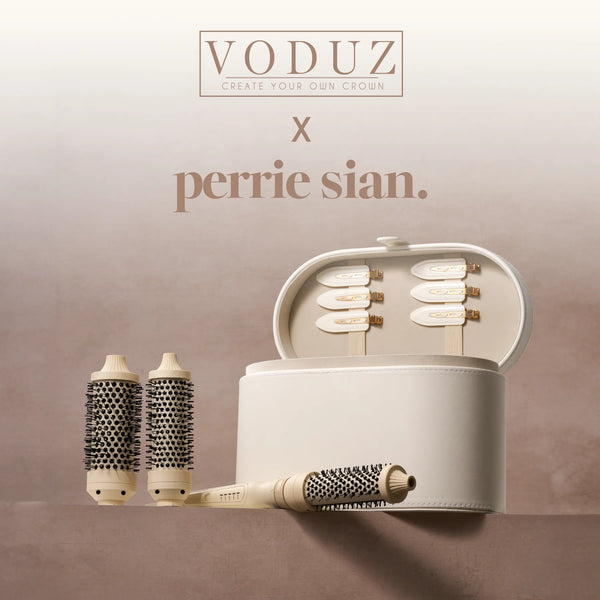 A Voduz x Perrie Sian 3-IN-1 Hot Brush shown with saude packaging and accessories with chic styling and has a beige handle and ceramic-coated barrel for hair styling.