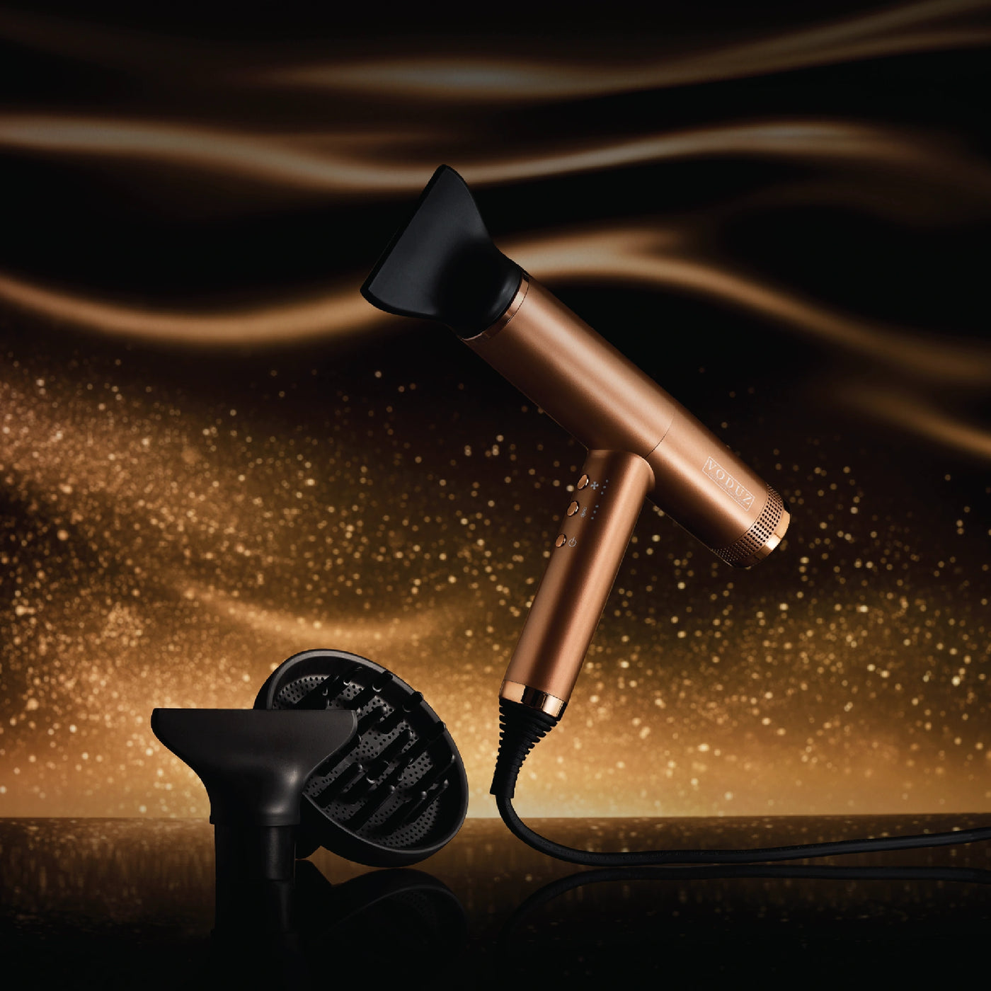 Bronze Voduz Blow Out Pro hair dryer with packaging on a dark background