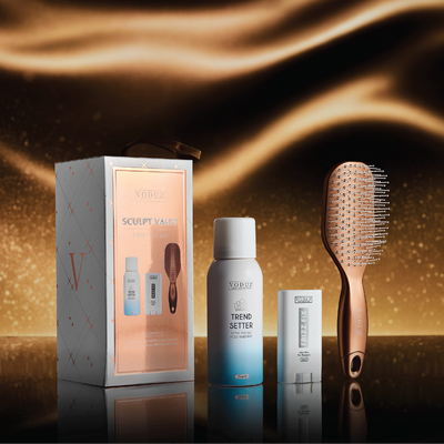 Voduz Sculp Vault hair care set with a box, bottle, and brush on a dark background
