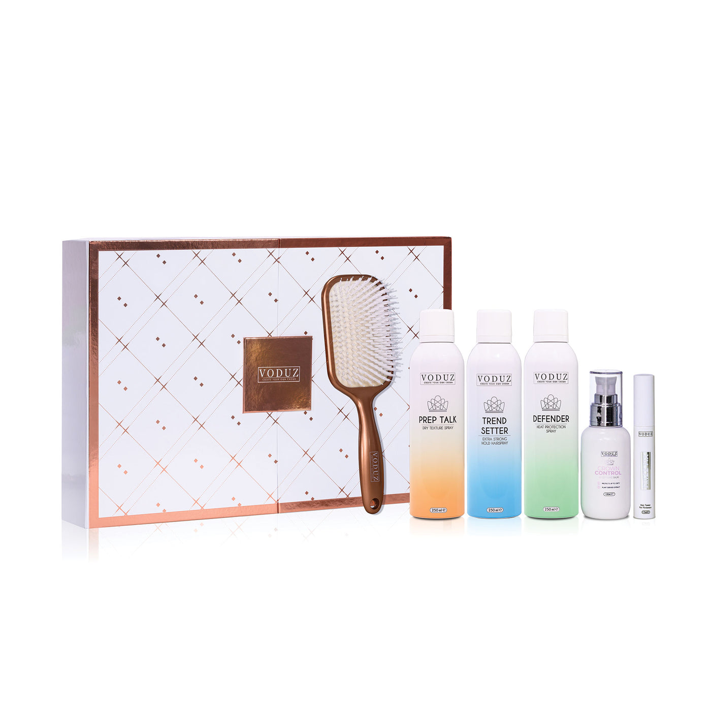 Volee hair care product set with a paddle brush and four bottles on a white background