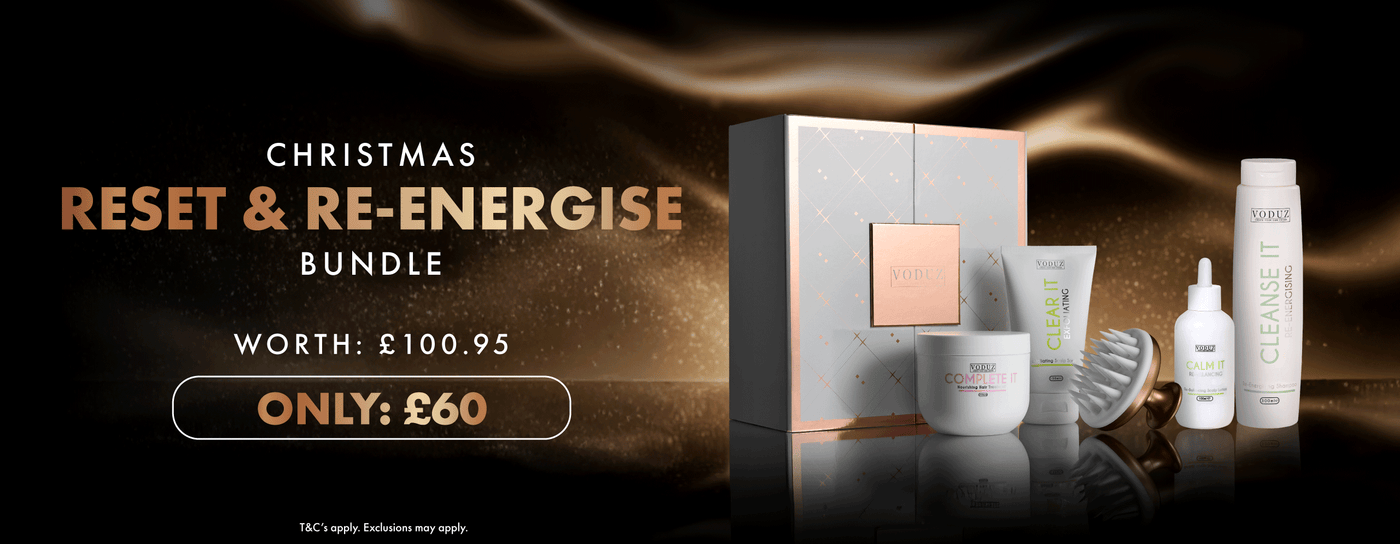 Voduz hair care bundle with packaging and bottles on a dark background, featuring text for a Christmas offer.